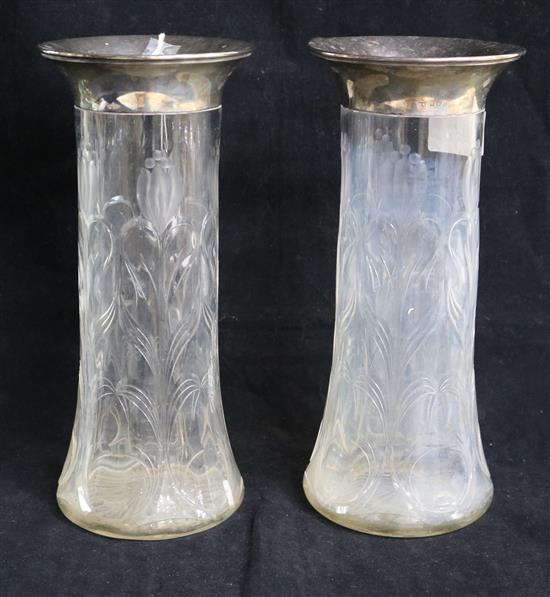 A pair of George V silver mounted rock crystal glass vases, by William Aitken, Birmingham, 1919, 28cm.